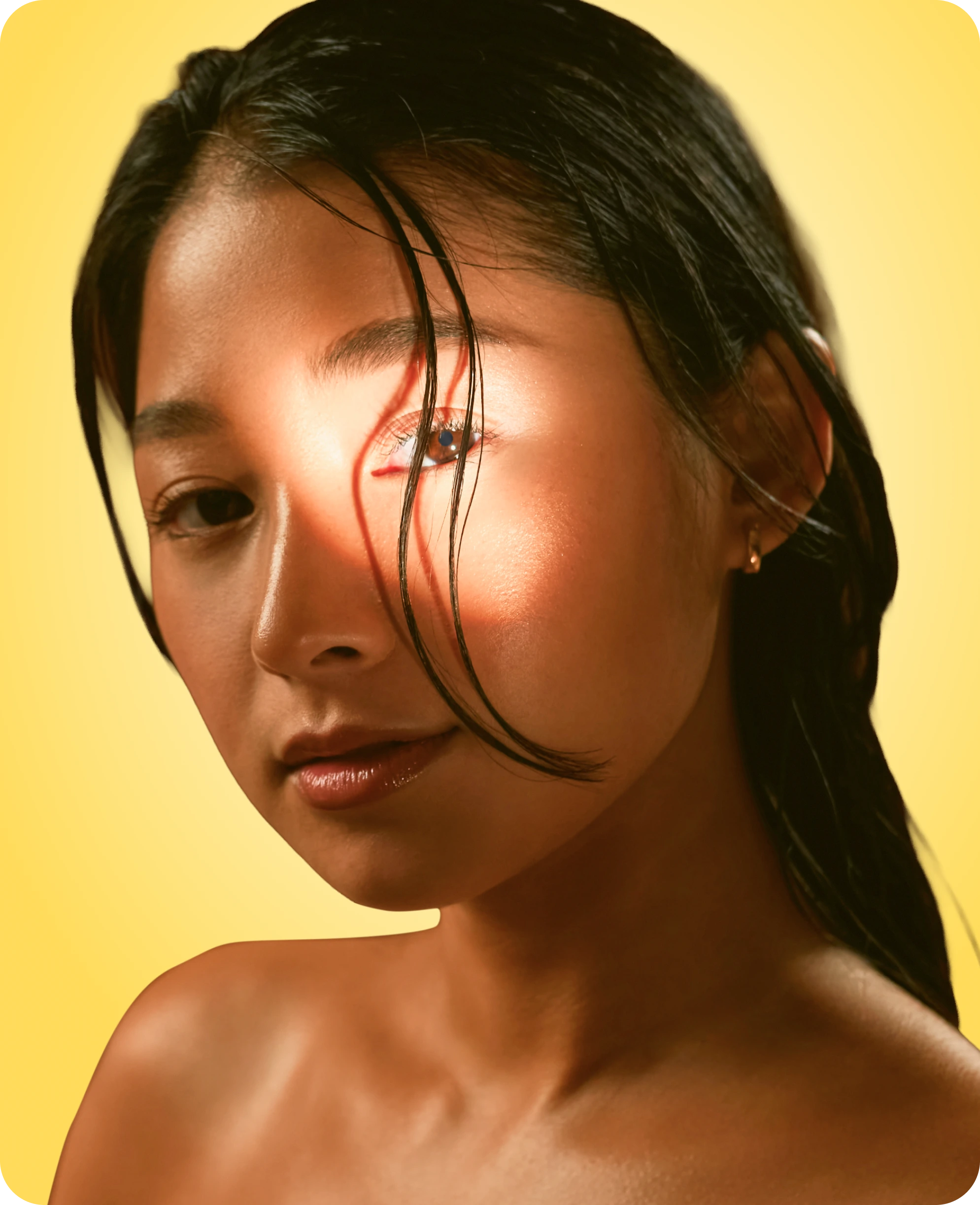 Tanned lady with light shining on face
